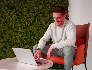 Business Development Manager Nicepixels with a Laptop